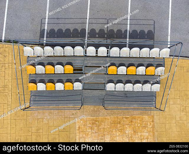 aerial view of small stands next to parking lot with seats for spectators at a fooball pitch in Altea La Vella, Alicante, Spain