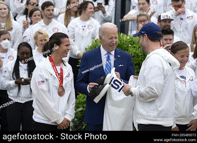 United States President Joe Biden receives gifts from members of Team USA during a ceremony celebrating their participation in the Tokyo 2020 Summer Olympic and...