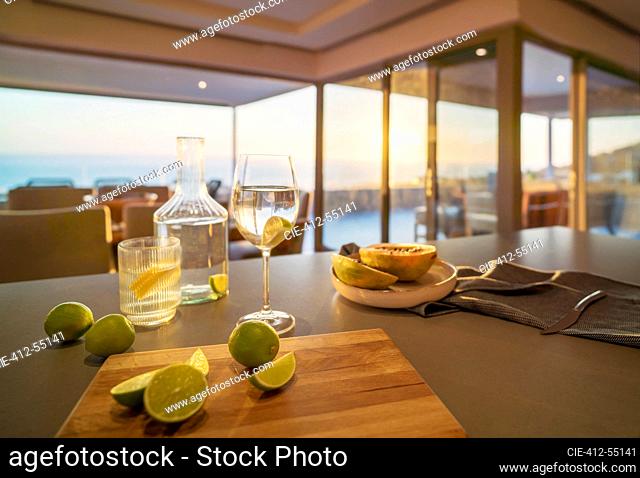 Water and limes on luxury home showcase kitchen counter