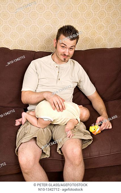 Young father with his six-month old son