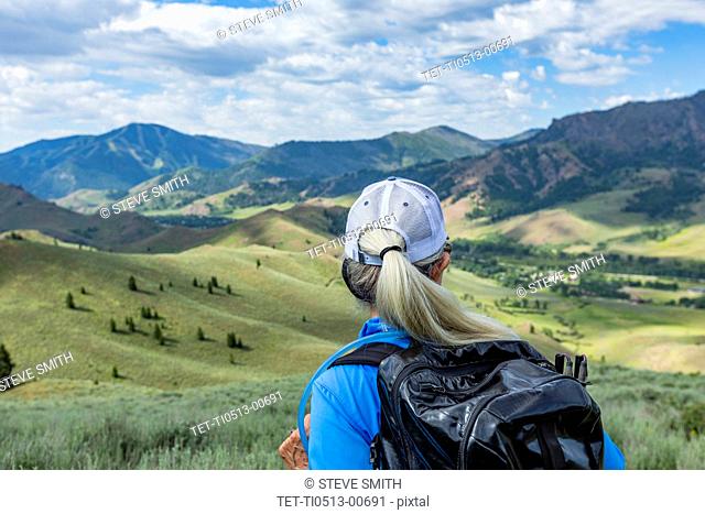 Rear view of mature woman hiking in Sun Valley, Idaho, USA