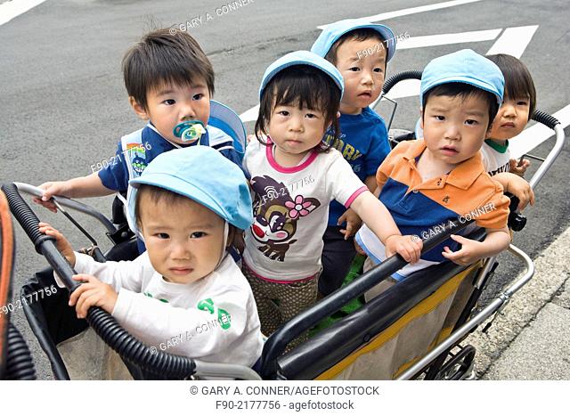 Children in daycare buggy in Tokyo, Japan