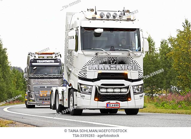 Lempaala, Finland. August 8, 2019. Black and white customized Renault Trucks T lorry and Volvo FH of Transmito Oy in convoy to Power Truck Show 2019