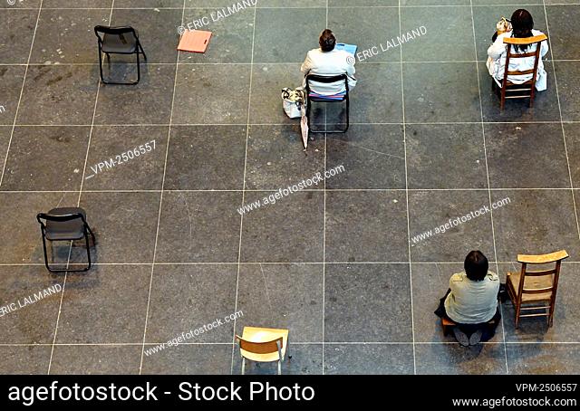 Illustration picture shows worshipers sitting on chairs that are placed at 1, 5m distance from each other, at the Nationale Basiliek van het Heilig Hart -...
