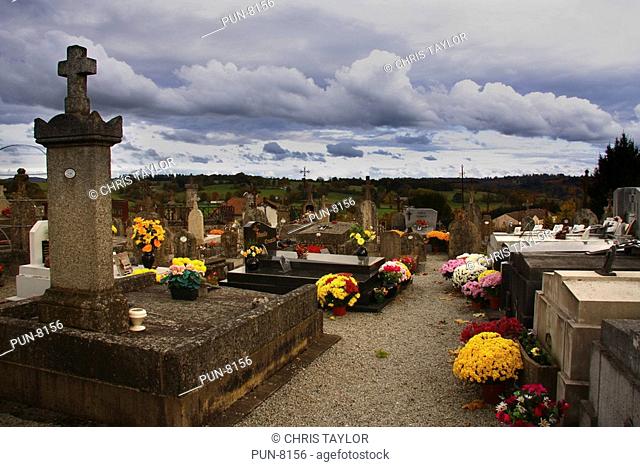 Floral displays placed beside the graves on the first of november at St Leonard de Noblat cemetery