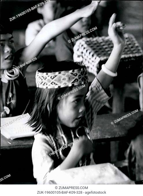 1962 - Drooping; Bejewelled Earlobes-And An Ex-Pupil At Ohio State Univ.: That's Sarawak's Jungle School A small girl sits demurely at her desk