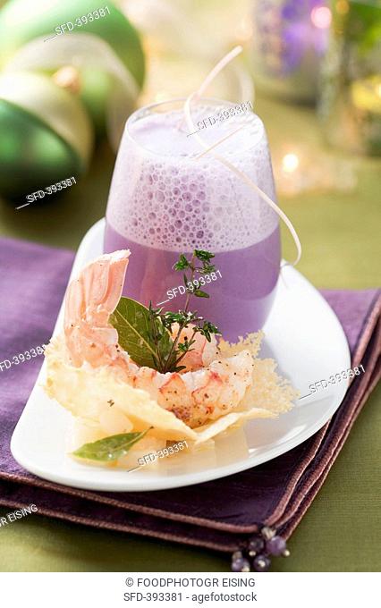 Red cabbage foam soup with Parmesan wafer and langoustines