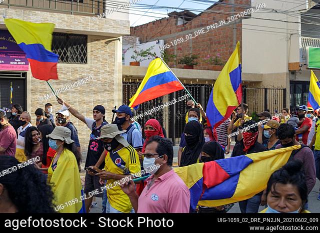Demonstrators wave colombian flags as demonstrations against the government of president Ivan Duque rise admist police brutality and unrest that resulted in at...