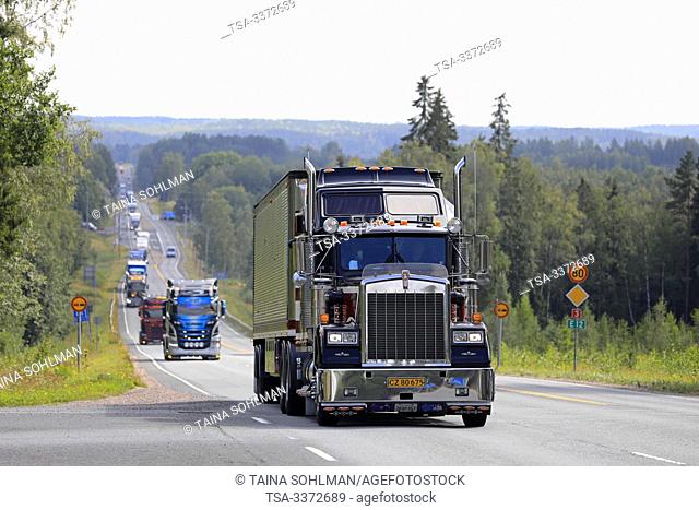 Ikaalinen, Finland. August 8, 2019. Kenworth W900 B 1987 Sundance Kid Saloon semi pulls Great Dane Trailer on road in convoy to Power Truck Show 2019