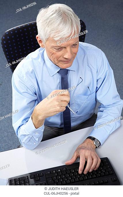 Mature businessman at desk