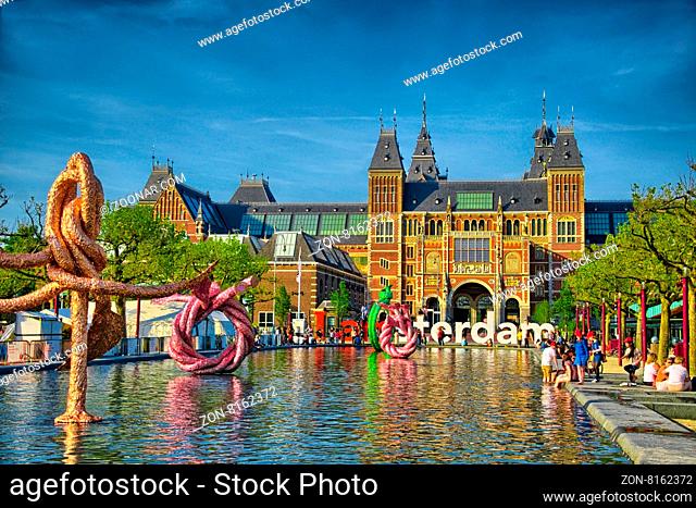 Sculptures in water near Rijksmuseum Amsterdam museum in Holland, Netherlads, HDR