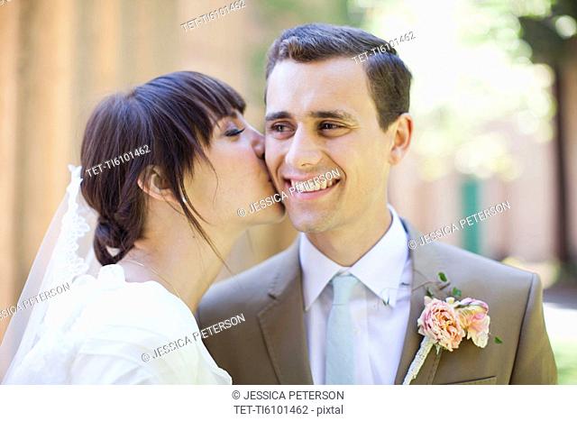 Portrait of young bride and groom