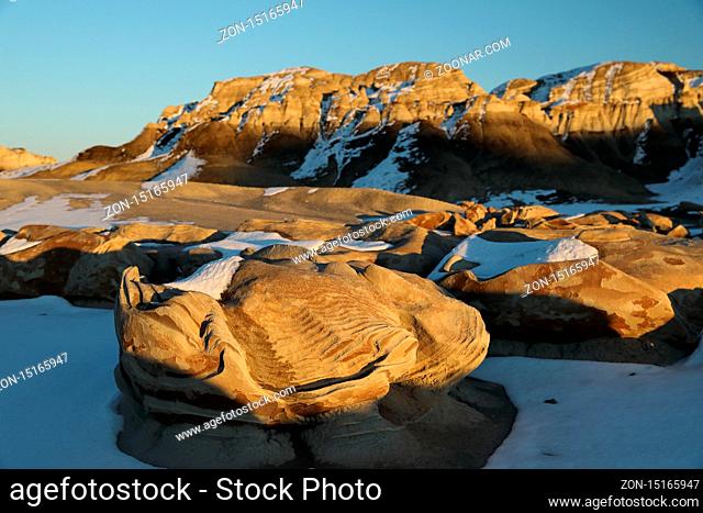 Striped rock eggs with sandstone at dawn, Bisti Badlands, De-Nah-Zin Wilderness Area, New Mexico, USA