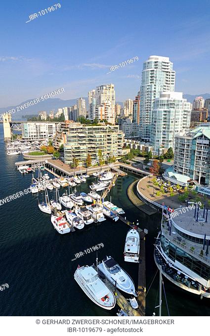 Boats at False Creek and the skyline of Vancouver, British Columbia, Canada, North America