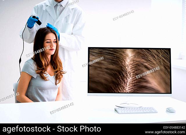 Close-up Of Dermatologist Using Trichoscope For Hair Fall Treatment His Clinic