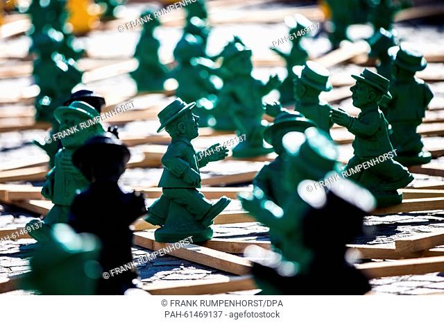 German Unity figures are seen on the 'Roemerberg' in Frankfurt/Main, Germany, 10 September 2015. As a part of an art installation, more than 1000 little green