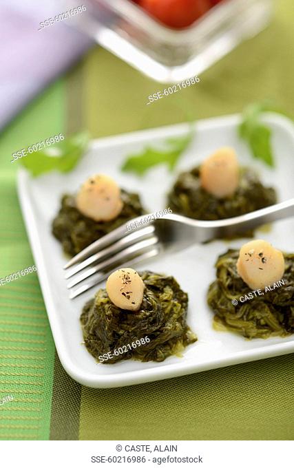 Small spinach nests topped with scallops
