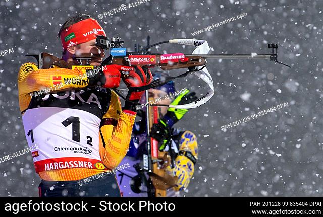 28 December 2020, Bavaria, Ruhpolding: Biathlon: World Team Challenge (WTC), mass start, mixed, in the Chiemgau Arena. Benedikt Doll from Germany in action at...