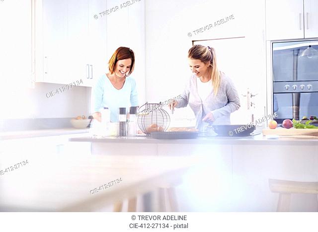 Women baking in kitchen