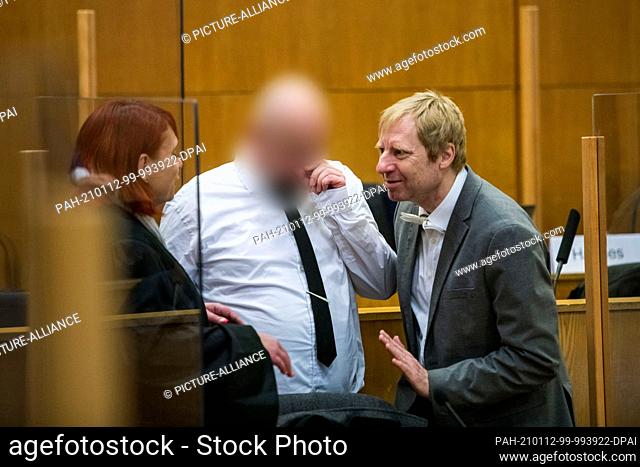 12 January 2021, Hessen, Frankfurt/Main: Co-defendant Markus H. (M) stands at the beginning of another hearing in the case of the murder of W
