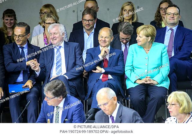24 July 2019, Berlin: Angela Merkel (r-l, CDU), Federal Chancellor, Olaf Scholz (SPD), Minister of Finance, Horst Seehofer (CSU, Minister of the Interior