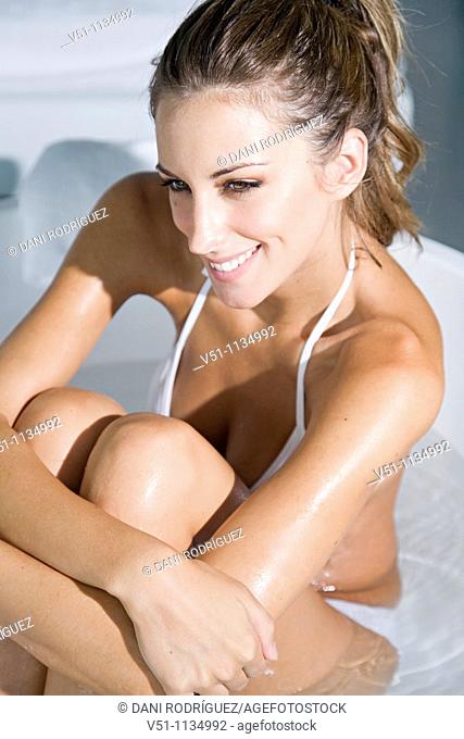 Young woman enjoying a bath