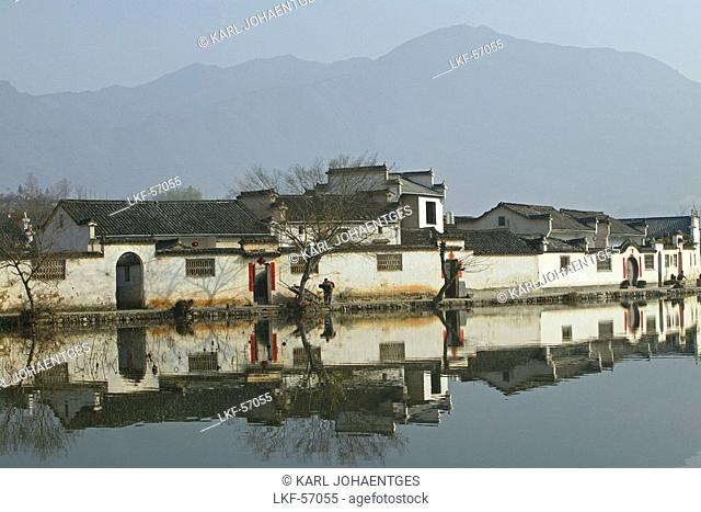 The pond reflecting the traditional houses of the village Hongcun, Huangshan, China, Asia