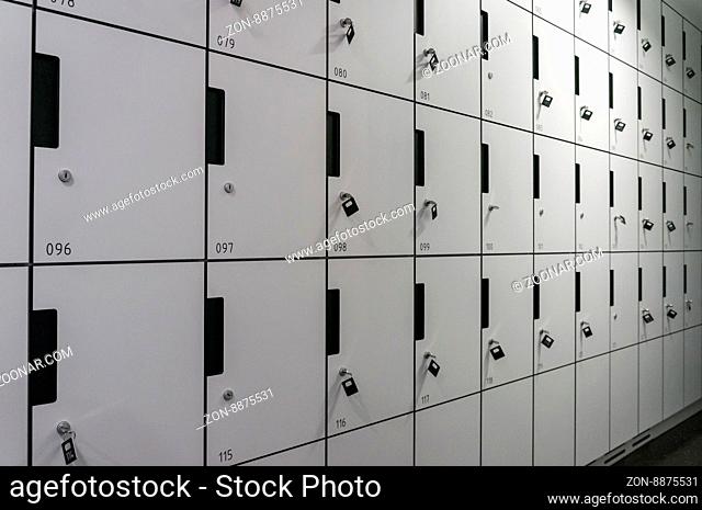 row of locker box - stainless steel panel key lock numbers