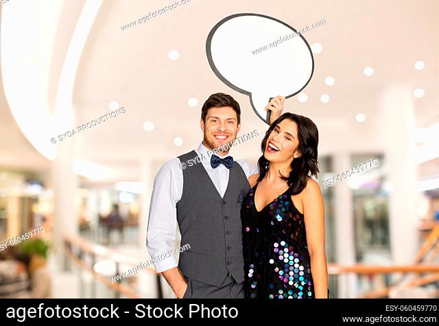 happy couple at party holding text bubble banner