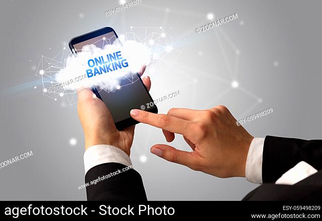 Female hand touching smartphone with ONLINE BANKING inscription, cloud business concept