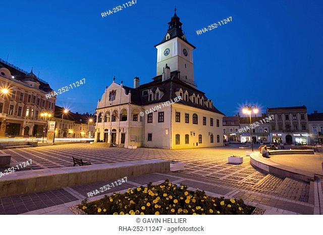 The Council House Casa Sfatului dating from 1420 topped by a Trumpeter's Tower, the old city hall now houses the Brasov Historical Museum, illuminated at dusk