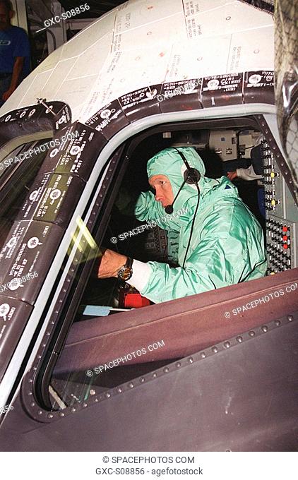 09/28/2001 -- During Crew Equipment Interface Test CEIT activities at KSC, STS-108 Commander Dominic L. Gorie checks the windshield inside orbiter Endeavour