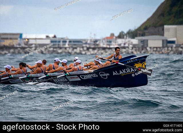 Crew of Bermeo rowing boat in action during XIV. Getariako Ikurrina men’s regatta of the ACT League (The Association of Clubs of rowing boats)