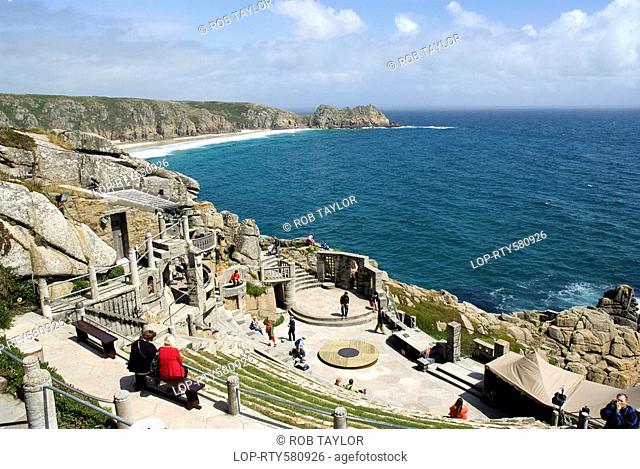 England, Cornwall, Porthcurno, A view down over the steep seating and stage at the Minack Theatre towards Porthcurno Bay and Logan Rock in the background