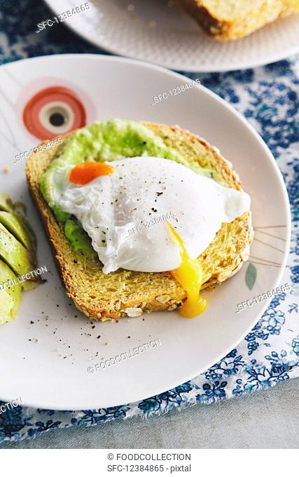 Oat and sweet potato bread topped with avocado and a poached egg