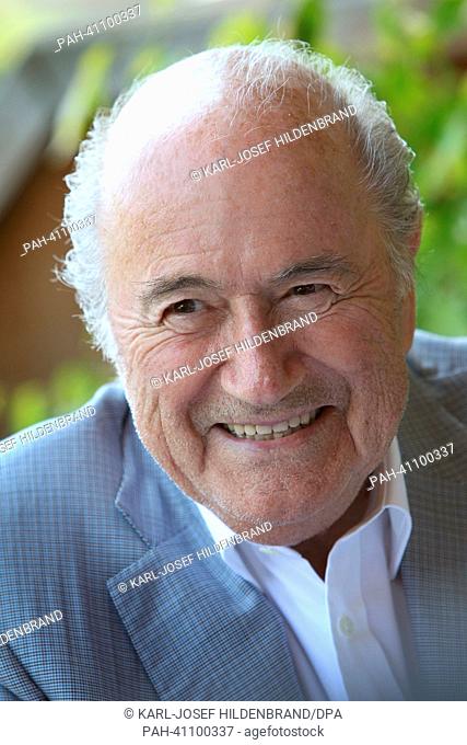FIFA presiddent Sepp Blatter laughs during the 'Camp Beckenbauer' in Going, Austria, 17 July 2013. The forum deals with the future of the sport
