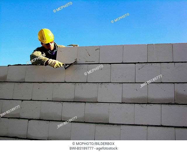 building worker building a house