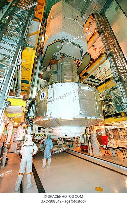 06/26/2001 -- In the Payload Changeout Room, Launch Pad 39B, the Joint Airlock Module below and Space Lab Double Pallet above are moved into the payload bay of...