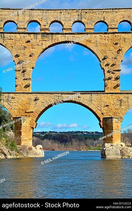 Central section of the Ancient Roman Pont du Gard aqueduct and viaduct bridge over the River Gardon, the highest of all ancient roman bridges