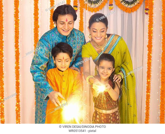 Family celebrates diwali festivals MR779P , MR779Q , MR779R , MR779S