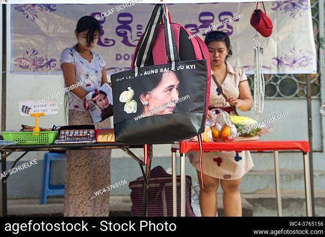 Yangon, Republic of the Union of Myanmar, Asia - A small backpack with the image of Aung San Suu Kyi is offered for sale at a street market in downtown Yangon