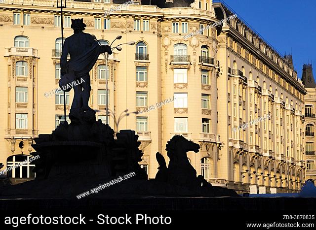 neptuno fountain silhouette with the palace hotel. madrid. spain