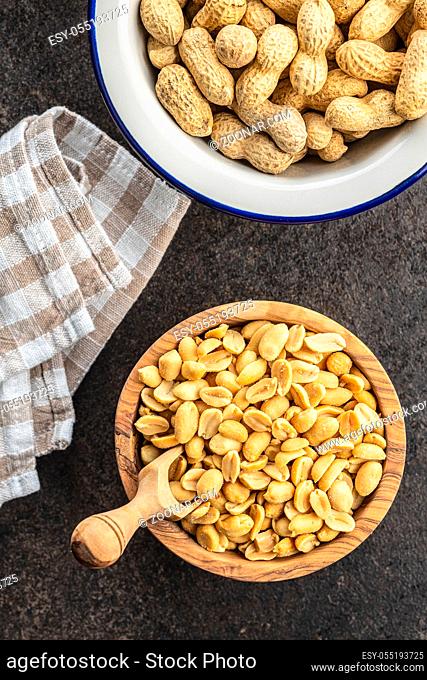 Roasted salted peanuts. Crispy nuts in bowl. Top view