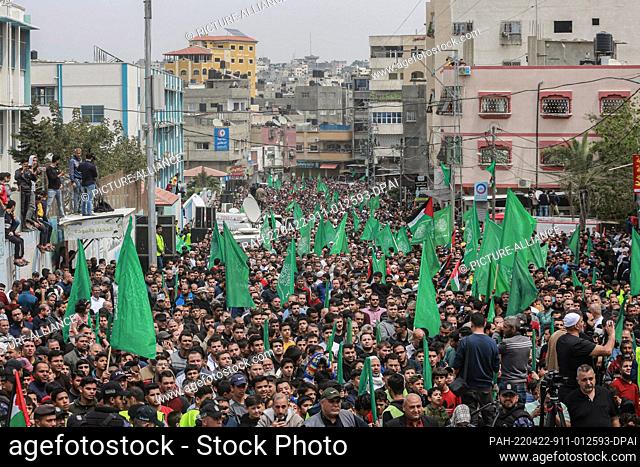 22 April 2022, Palestinian Territories, Jabalia: Supporters of Palestinian Islamist movement Hamas take part in a demonstration after the end of the weekly...