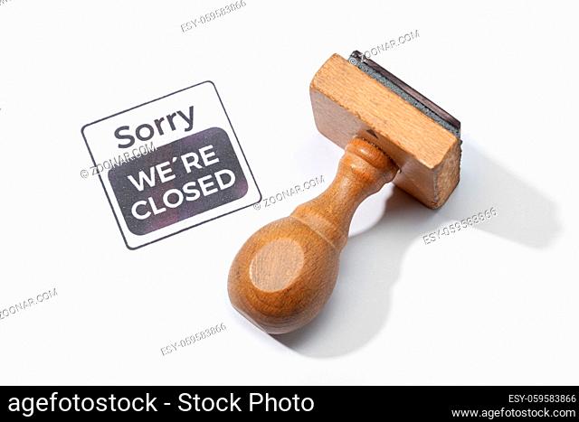 Rubber stamp with sorry we are closed text. Closed by coronavirus or covid-19 concept
