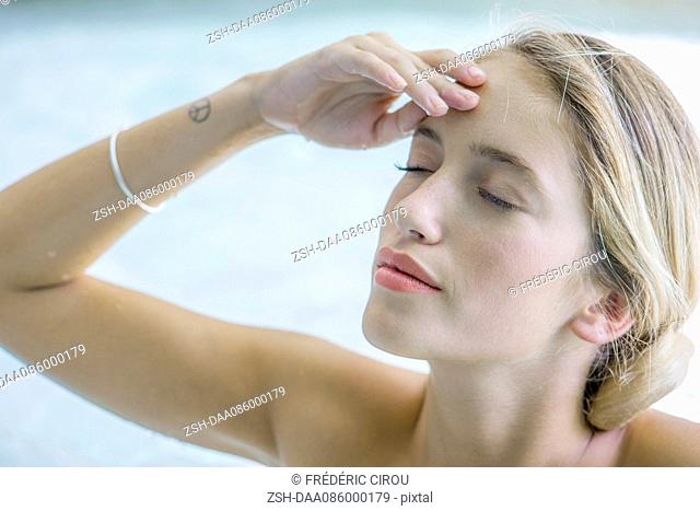 Woman massaging her forehead