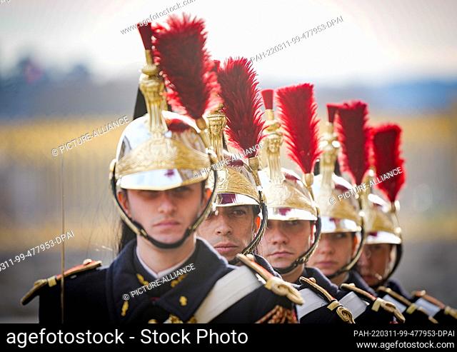 11 March 2022, France, Versailles: French soldiers of the honor guard line up in front of the Palace of Versailles at the beginning of the meeting of European...