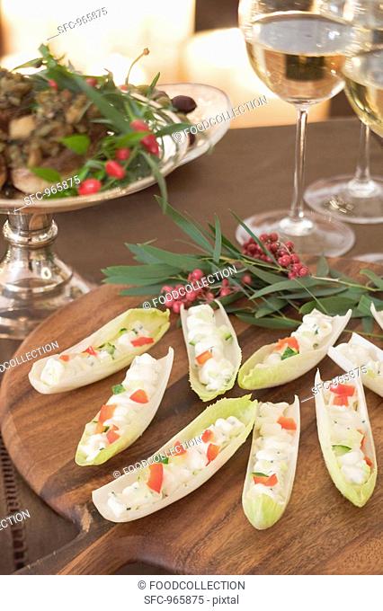 Chicory boats filled with soft cheese Christmas