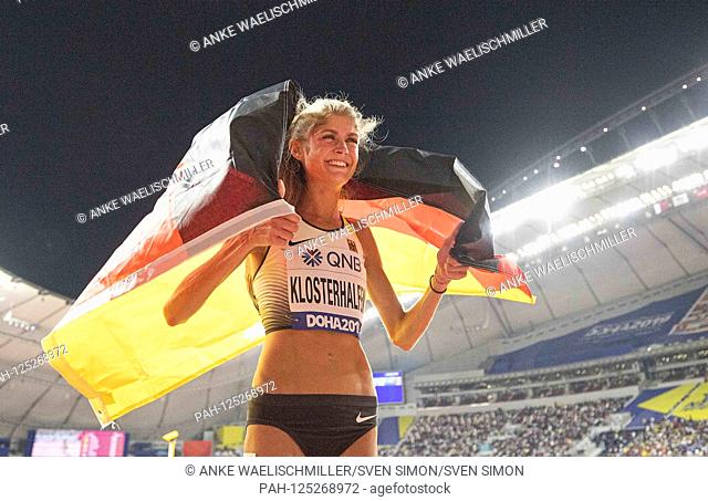 jubilation Konstanze KLOSTERHALFEN (Germany / 3rd place) with flag. Women's Final 5000m, on 05.10.2019 World Athletics Championships 2019 in Doha / Qatar
