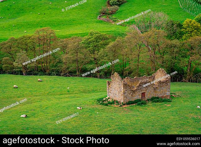 An old stone barn on a meadow near Lofthouse, North Yorkshire, England, UK